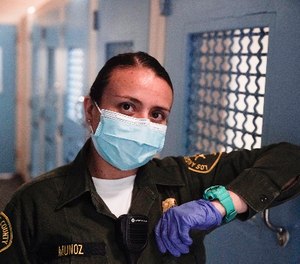 Sonia Munoz, a custody assistant, poses for a picture at the hospital ward of the Twin Towers jail in Los Angeles.