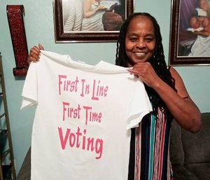 Betty Riddle in Sarasota, Fla., holds the T-shirt she wore on March 17, 2020, when she voted for the first time. (Photo courtesy of Rickie Riddle via AP)