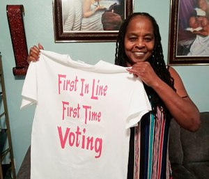 Betty Riddle in Sarasota, Fla., holds the T-shirt she wore on March 17, 2020, when she voted for the first time.