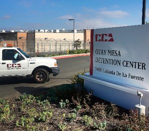 A vehicle drives into the Otay Mesa Detention Center in San Diego. (AP Photo/Elliot Spagat)