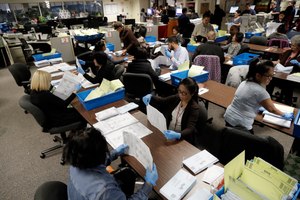 This Nov. 4, 2016, photo shows mail-in ballots being sorted at the Santa Clara County Registrar of Voters in San Jose, Calif. Facing an array of unknowns from the coronavirus crisis, California will send every voter a mail-in ballot for the November presidential election, Gov. Gavin Newsom announced Friday, May 8, 2020. Image: AP Photo/Marcio Jose Sanchez