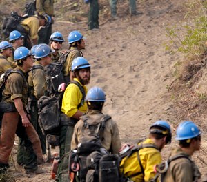 Newly released national plans for fighting wildfires during the coronavirus pandemic are hundreds of pages long but don't offer many details on how fire managers will get access to COVID-19 tests or exactly who will decide when a crew needs to enter quarantine.