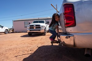 In this April 22, 2020, photo, a little girl plays in her family compound in Tuba City, Ariz. Even before the pandemic, people living in rural communities and on reservations were among the toughest groups to count in the 2020 census. Image: AP Photo/Carolyn Kaster