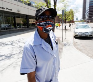 A resource published by the National Academies of Sciences, Engineering and Medicine offers strategies for promoting COVID-19-preventing behaviors, such encouraging people to wear face masks displaying the logo of their favorite sports team. (AP Photo/David Zalubowski)