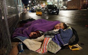 Two people sleep on a street in downtown Portland, Ore. Image: AP Photo/Ted S. Warren