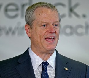 In this May 5, 2020, photo, Massachusetts Gov. Charlie Baker speaks during a news conference. (Stuart Cahill/Boston Herald via AP, Pool)