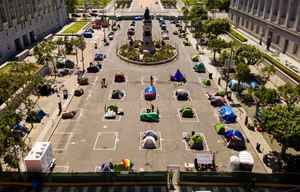 Rectangles designed to help prevent the spread of the coronavirus by encouraging social distancing line a city-sanctioned homeless encampment at San Francisco's Civic Center on Thursday, May 21, 2020. Image: AP Photo/Noah Berger