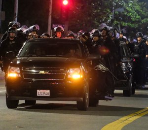 LAPD riot police stand by outside City Hall during the civil unrest in 2020.