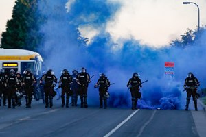 Police in riot gear prepare to advance on protesters, Saturday, May 30, 2020, in Minneapolis. Image: AP Photo/John Minchillo