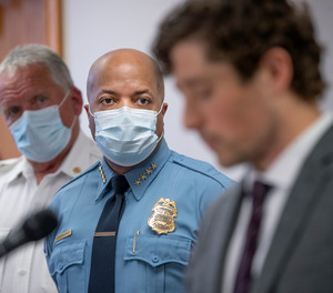 In this May 28, 2020, file photo, Minneapolis Police Chief Medaria Arradondo, center, listens as Minneapolis Mayor Jacob Frey becomes emotional during a news conference in Minneapolis, Minn.