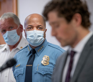 In this May 28, 2020, file photo, Minneapolis Police Chief Medaria Arradondo, center, listens as Minneapolis Mayor Jacob Frey becomes emotional during a news conference in Minneapolis, Minn.