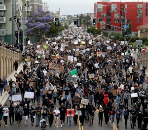 Protestors march Thursday, June 4, 2020, in San Diego after the death of George Floyd.