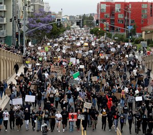 Protestors march Thursday, June 4, 2020, in San Diego after the death of George Floyd.