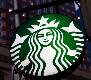 This June 26, 2019, file photo shows a Starbucks sign in downtown Pittsburgh.