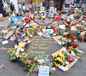 Memorials continue to grow Monday, June 15, 2020 at the site of the arrest of George Floyd. Floyd died in police custody after video shared online by a bystander showed former officer Derek Chauvin kneeling on Floyds' neck during his arrest as he pleaded that he couldn't breathe.