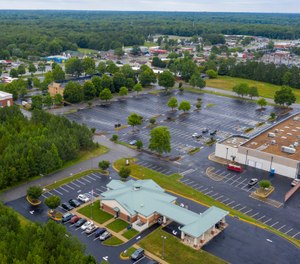This aerial drone photo shows the Call Federal Credit Union building, front, Tuesday June 16, 2020, in Midlothian, Va. Police were able to obtain geofence search warrants, a tool being increasingly used by law enforcement. The warrant sought location histories kept by Google of cellphones and other devices used within 150 meters (500 feet) of the bank. (AP Photo/Steve Helber)