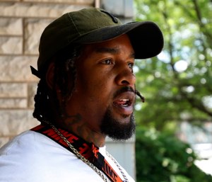 Daylan McLee stands on the porch of his home in Uniontown, Pa.