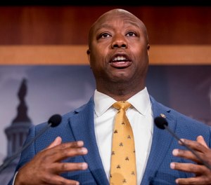 Sen. Tim Scott, R-S.C., accompanied by Republican senators speaks at a news conference to announce a Republican police reform bill on Capitol Hill in Washington. (AP Photo/Andrew Harnik)