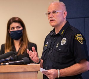 Tucson Police Chief Chris Magnus, right, speaks as Mayor Regina Romero listens during a press conference, Wednesday, June 24, 2020, in Tucson, Ariz. (Josh Galemore/Arizona Daily Star via AP)
