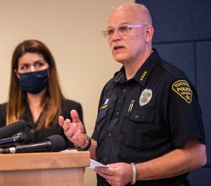 Tucson Police Chief Chris Magnus, right, speaks as Mayor Regina Romero listens during a press conference, Wednesday, June 24.