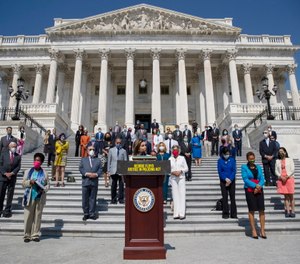House Speaker Nancy Pelosi of Calif., joined by House Democrats spaced for social distancing, speaks during a news conference on the House East Front Steps on Capitol Hill in Washington, Thursday, June 25, 2020, ahead of the House vote on the George Floyd Justice in Policing Act of 2020.