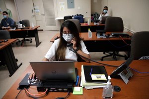 Maria Fernanda works on contact tracing at the Florida Department of Health in Miami-Dade County. Contact tracers are often met with reluctance, and sometimes anger, when attempting to do their jobs. Image: AP Photo/Lynne Sladky