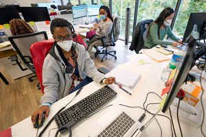 Contact tracers, from left to right, Christella Uwera, Dishell Freeman and Alejandra Camarillo work at Harris County Public Health contact tracing facility Thursday, June 25, 2020, in Houston. Contact tracing apps have the potential to solve a lot of the problems associated with manual tracing, but only if enough people use them. Image: AP Photo/David J. Phillip