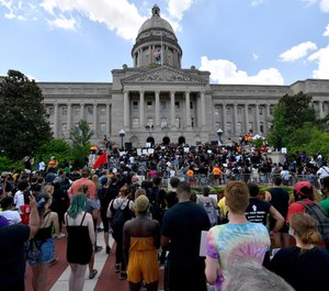 A crowd gathers for a rally to demand justice in the death of Breonna Taylor on the steps of the the Kentucky State Capitol in Frankfort, Ky., Thursday, June 25, 2020. (AP Photo/Timothy D. Easley)