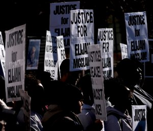 Demonstrators gather for a press conference at the Aurora Municipal Center after the police department released the body camera footage of Elijah McClain, who died after being stopped by three Aurora officers in August 2019.