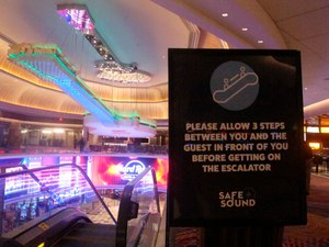This June 24, 2020 photo shows a sign in the Hard Rock casino in Atlantic City N.J. instructing customers to maintain a distance on the escalator to prevent the spread of the coronavirus. Image: AP Photo/Wayne Parry