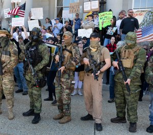 People, including those with the boogaloo movement, demonstrate against business closures due to concern about COVID-19, at the State House in Concord, N.H. on May 2, 2020.