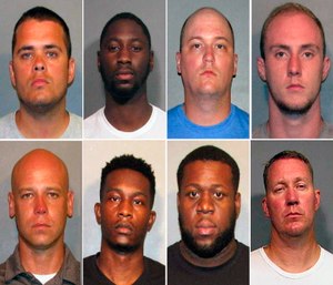 These photos provided by the Caddo Parish Sheriff's Office show, top row from left, police officers Aaron Jaudon, D'Andre Jackson, Mark Ordoyne and William Isenhour. Bottom row from left show police officers Christopher McConnell, Brandon Walker, Treveion Brooks and David Francis.