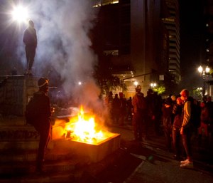 Portland police say more than 12 people were arrested after throwing fireworks and mortars as they clashed with police during the latest rally decrying police brutality.