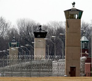 Guard towers and razor wire ring the compound at the U.S. Penitentiary in Terre Haute, Ind., the site of the last federal execution. (AP Photo/Michael Conroy)