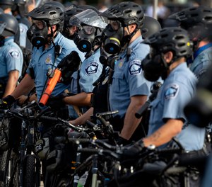 On May 27, 2020 police gather en masse as protests continue at the Minneapolis 3rd Police Precinct in Minneapolis.