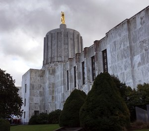 In this Jan. 11, 2018, file photo, clouds hover over the Oregon State Capitol in Salem, Ore.
