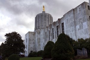Clouds hover over the Oregon State Capitol in Salem, Ore. Acting quickly after the death of George Floyd, Oregon has publicly named bad apples among law enforcement. Image: AP Photo/Andrew Selsky