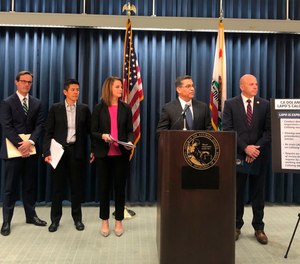 In this Feb. 10, 2020, file photo, California Attorney General Xavier Becerra, second from right, announces an independent review of LAPD's use of a gang member database after allegations of misuse in Los Angeles.