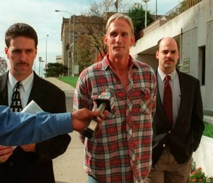 In this 1998 photo, Wesley Ira Purkey, center, is escorted by police officers in Kansas City, Kan., after he was arrested in connection with the death of 80-year-old Mary Ruth Bales. (Photo/Jim Barcus of The Kansas City Star via AP)
