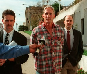 In this 1998 photo, Wesley Ira Purkey, center, is escorted by police officers in Kansas City, Kan., after he was arrested in connection with the death of 80-year-old Mary Ruth Bales. (Photo/Jim Barcus of The Kansas City Star via AP)