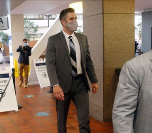 Former Minneapolis Police Officer Thomas Lane enters the Hennepin County Government Center on Tuesday, July 21, 2020, in Minneapolis for a hearing.