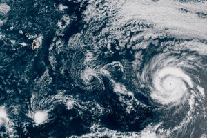 This GOES-17 taken at 3:30 p.m. EDT, Thursday, July 23, 2020, shows Hurricane Douglas, right, churning in the Pacific Ocean heading towards Hawaii, left. The storm is currently a Category 3 hurricane but is expected to weaken before it arrives in the state this weekend. Image: NOAA via AP