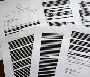 This photo shows a report provided by the Virginia Office of the State Inspector General to The Associated Press in response to an open records request.