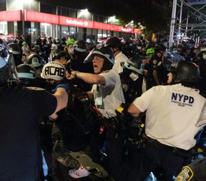 NYPD officers clash with demonstrators during a protest on July 25, 2020. The FDNY has formally prohibited the use of fire hoses on unruly crowds amidst ongoing demonstrations, the New York Post reports.