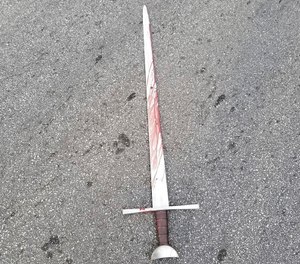 This Thursday, July 30, 2020, photo shows blood on the sword police say the suspect swung at officers. (Detroit Police Department via AP)