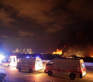Ambulances drive past the site of a massive explosion in Beirut, Lebanon, Tuesday, Aug. 4, 2020. A San Antonio couple who survived the blast are raising money to by more ambulances for EMS providers in Lebanon.