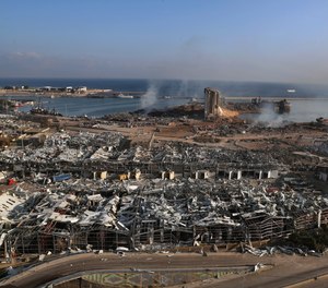 Smoke rises from the scene of an explosion that hit the seaport of Beirut, Lebanon, Wednesday, Aug. 5, 2020.