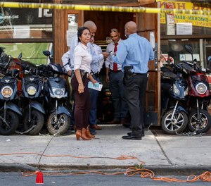 Police officers respond to a crime scene on Nostrand Avenue, where a man was discovered with gunshot wounds before being transported to a hospital where he died from his injuries in Brooklyn on Saturday, July 18, 2020.