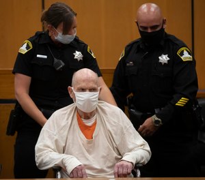 Joseph James DeAngelo, sitting in a wheelchair, is brought out of the courtroom for a break in the schedule for the third day of victim impact statements on Thursday, Aug. 20, 2020, in Sacramento, Calif.
