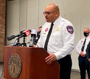 Southfield, Mich., Fire Chief Johnny Menifee speaks at a news conference on Aug. 26, 2020 after a woman, Timesha Beauchamp, was declared dead and later found alive at a funeral home. Two firefighter-paramedics whose licenses were suspended following the incident will be allowed to regain their licenses if they pass a national exam, state officials say.